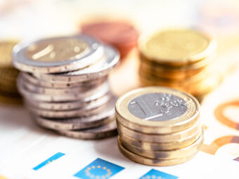Euro coins on euro banknotes