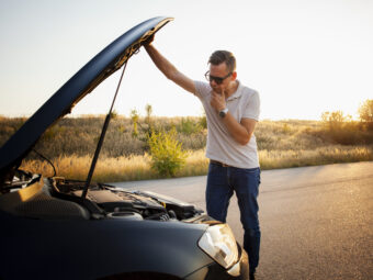 young-man-checking-car-engine